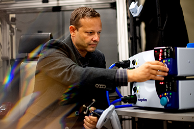 gene tunik working in lab